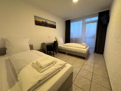 Ein Bett oder Betten in einem Zimmer der Unterkunft Hotel Main Taunus