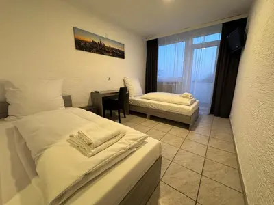 Ein Bett oder Betten in einem Zimmer der Unterkunft Hotel Main Taunus