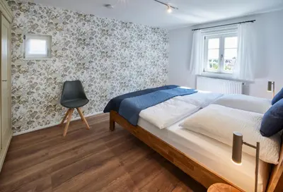 Ein Bett oder Betten in einem Zimmer der Unterkunft Winzerlodge, Wohnung Muskateller