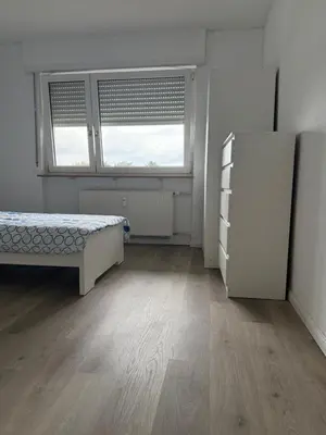 Ein Bett oder Betten in einem Zimmer der Unterkunft Monteur- und Ferienwohnung Hemsbach