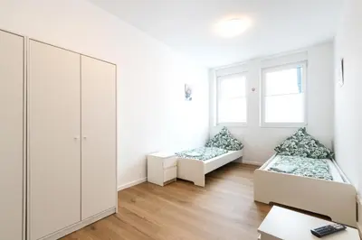 Ein Bett oder Betten in einem Zimmer der Unterkunft N8 - Business-Appartment-Hotel by Villa Dörr