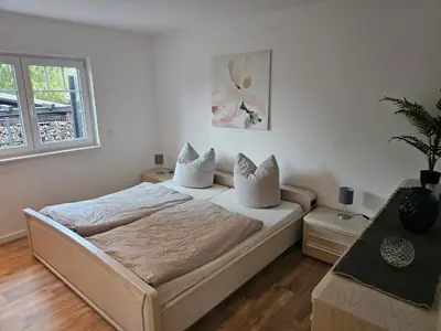 Ein Bett oder Betten in einem Zimmer der Unterkunft Ferienwohnung Königsberg