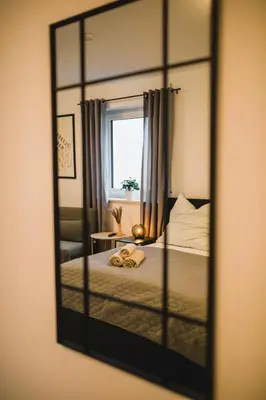 Ein Bett oder Betten in einem Zimmer der Unterkunft HUGOS Design House am Waldrand - ruhig & modern