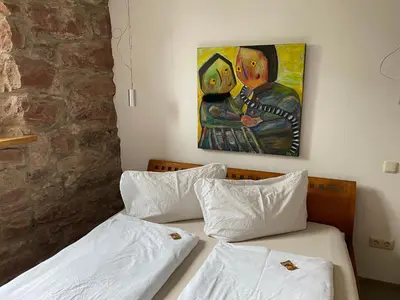 Ein Bett oder Betten in einem Zimmer der Unterkunft Denkmal - Alte Schleiferei