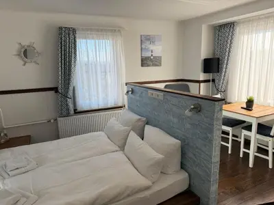 Ein Bett oder Betten in einem Zimmer der Unterkunft Hotel Schöne Aussicht renoviert