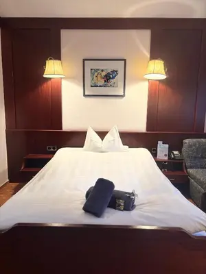 Ein Bett oder Betten in einem Zimmer der Unterkunft Hotel Hubertus Gernsheim Rhein