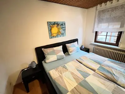 Ein Bett oder Betten in einem Zimmer der Unterkunft Ferienwohnung Gaby - im Weingut Doll