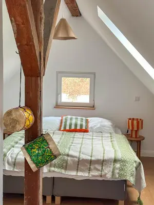 Ein Bett oder Betten in einem Zimmer der Unterkunft Zita Ferienhäuser - Ferienhaus Burgi