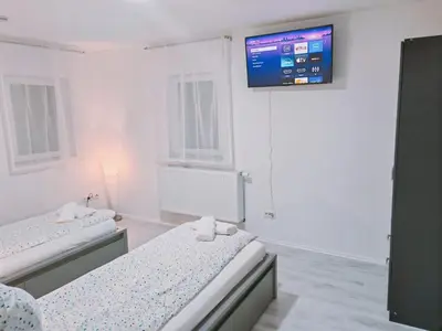 Ein Bett oder Betten in einem Zimmer der Unterkunft Charmantes schickes Apartment