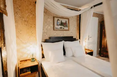Ein Bett oder Betten in einem Zimmer der Unterkunft Altes Häusle am Waschbach-Weintraube