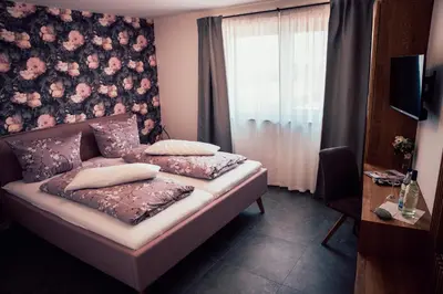 Ein Bett oder Betten in einem Zimmer der Unterkunft Gästezimmer im FamilienWeingut Räder