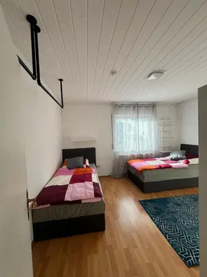 Ein Bett oder Betten in einem Zimmer der Unterkunft WAT Wohnung GR
