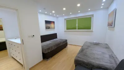 Ein Bett oder Betten in einem Zimmer der Unterkunft FeWo-Seeheim Barrierefrei EG