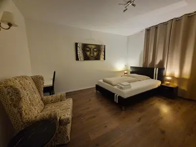 Ein Bett oder Betten in einem Zimmer der Unterkunft Gemütliches Privatzimmer mit französischem Doppelbett an der Universitätsklinik Mainz