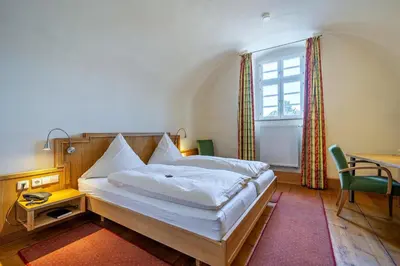 Ein Bett oder Betten in einem Zimmer der Unterkunft Schlosshotel Ravenstein