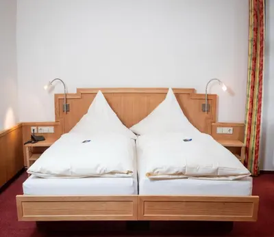 Ein Bett oder Betten in einem Zimmer der Unterkunft Schlosshotel Ravenstein