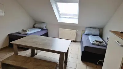 Ein Bett oder Betten in einem Zimmer der Unterkunft 2 x Einzelbett Studio