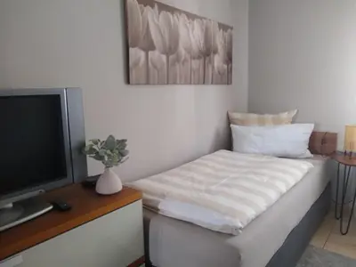 Ein Bett oder Betten in einem Zimmer der Unterkunft Fröhlich Wohnen in Fewo Frölich