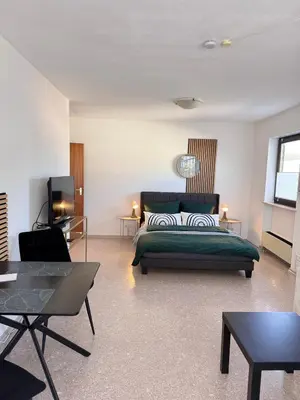 Ein Bett oder Betten in einem Zimmer der Unterkunft La Inside Apartment
