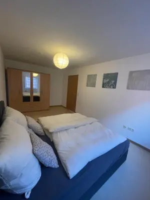 Ein Bett oder Betten in einem Zimmer der Unterkunft Ferienwohnung im Herzen von Walldürn