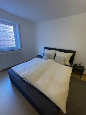 Ein Bett oder Betten in einem Zimmer der Unterkunft Ferienwohnung im Herzen von Walldürn