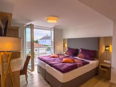 Ein Bett oder Betten in einem Zimmer der Unterkunft Hotel Restaurant Traube Kallstadt