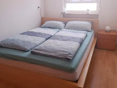 Ein Bett oder Betten in einem Zimmer der Unterkunft Ferienwohnung Grundel