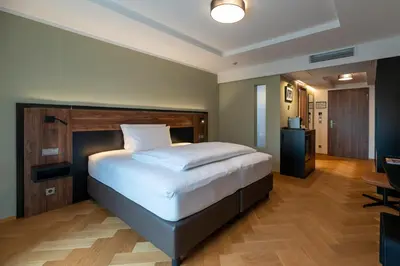 Ein Bett oder Betten in einem Zimmer der Unterkunft UNICO Boutique Hotel