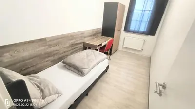 Ein Bett oder Betten in einem Zimmer der Unterkunft Opel2-Apartmenhaus