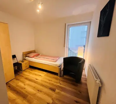 Ein Bett oder Betten in einem Zimmer der Unterkunft Apartmenthaus Gärtner