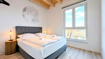 Ein Bett oder Betten in einem Zimmer der Unterkunft Velaris - Stilvolle Lofts & Penthouses - Premium Wohnen mit Parkplatz & Workstations