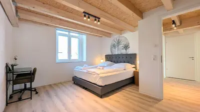 Ein Bett oder Betten in einem Zimmer der Unterkunft Velaris - Stilvolle Lofts & Penthouses - Premium Wohnen mit Parkplatz & Workstations