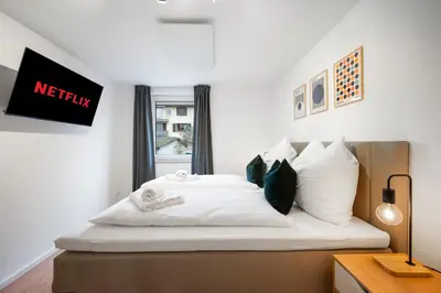 Ein Bett oder Betten in einem Zimmer der Unterkunft Moderne, ruhige Wohnung mit Parkplatz