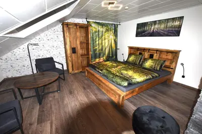 Ein Bett oder Betten in einem Zimmer der Unterkunft Ferienwohnung Odenwaldwellness