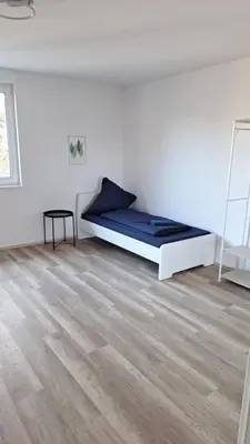 Ein Bett oder Betten in einem Zimmer der Unterkunft Monteurwohnung Pforzheim - L8 Street