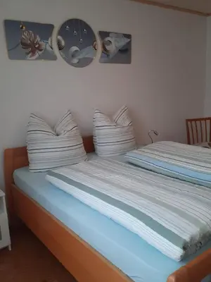 Ein Bett oder Betten in einem Zimmer der Unterkunft Ferienwohnung mit Terrasse