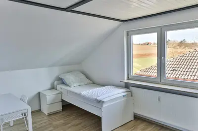 Ein Bett oder Betten in einem Zimmer der Unterkunft Ferienwohnung Höger Monteurwohnung