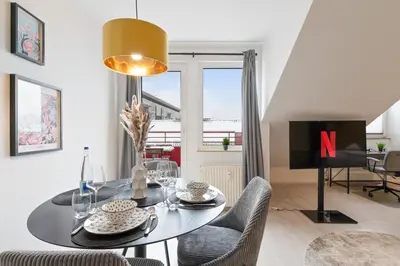 Ein Sitzbereich in der Unterkunft Kingsize Bett, Balkon, Arbeitsplatz, Netflix