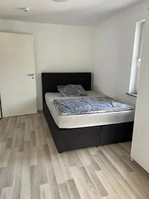 Ein Bett oder Betten in einem Zimmer der Unterkunft Haus Anna Bensheim
