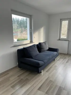 Ein Sitzbereich in der Unterkunft Gästezimmer im Haus Anna