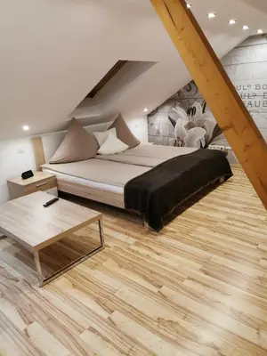 Ein Bett oder Betten in einem Zimmer der Unterkunft Apartmenthaus Wertheim