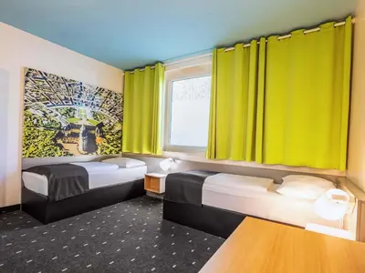 Ein Bett oder Betten in einem Zimmer der Unterkunft B&B Hotel Karlsruhe