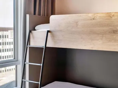 Ein Bett oder Betten in einem Zimmer der Unterkunft B&B Hotel Karlsruhe