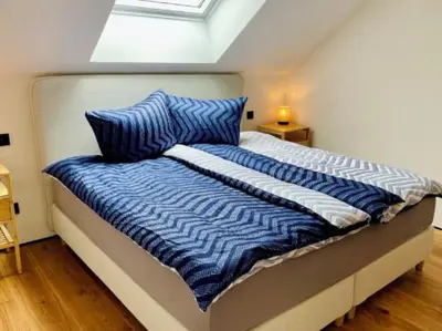 Ein Bett oder Betten in einem Zimmer der Unterkunft Ferienwohnung Weingut Braun & Söhne