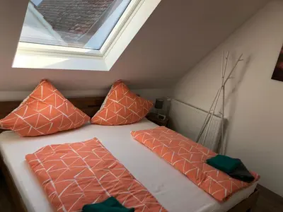 Ein Bett oder Betten in einem Zimmer der Unterkunft Haus Gaui
