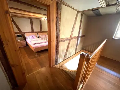 Ein Bett oder Betten in einem Zimmer der Unterkunft Schlafgut-Freytag Ferienhaus Pfälzer Bu