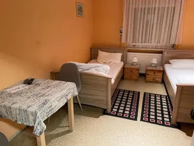Ein Bett oder Betten in einem Zimmer der Unterkunft Gaststätte Wiesengrund