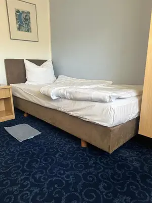 Ein Bett oder Betten in einem Zimmer der Unterkunft Hotel Alt Nürnberg