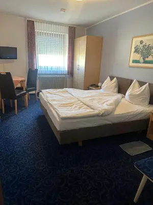 Ein Bett oder Betten in einem Zimmer der Unterkunft Hotel Alt Nürnberg
