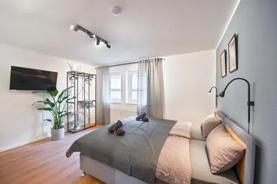 Ein Bett oder Betten in einem Zimmer der Unterkunft Amalfi A08 - super zentral für 4PP - 2 Zimmer & Boxspringbetten